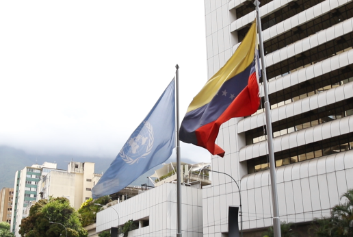 The flags of the UN and Venezuela.
